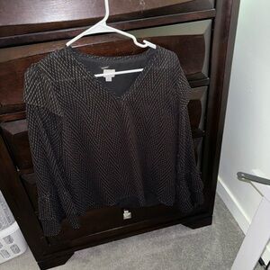 A New Day black with gold dots all over top